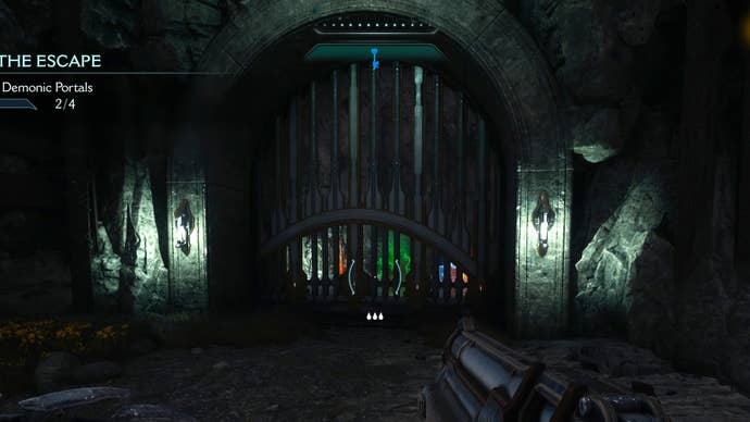 The player in Doom: The Dark Ages looks at a locked gate in Chapter 1, behind which can be seen various collectibles and pickups.