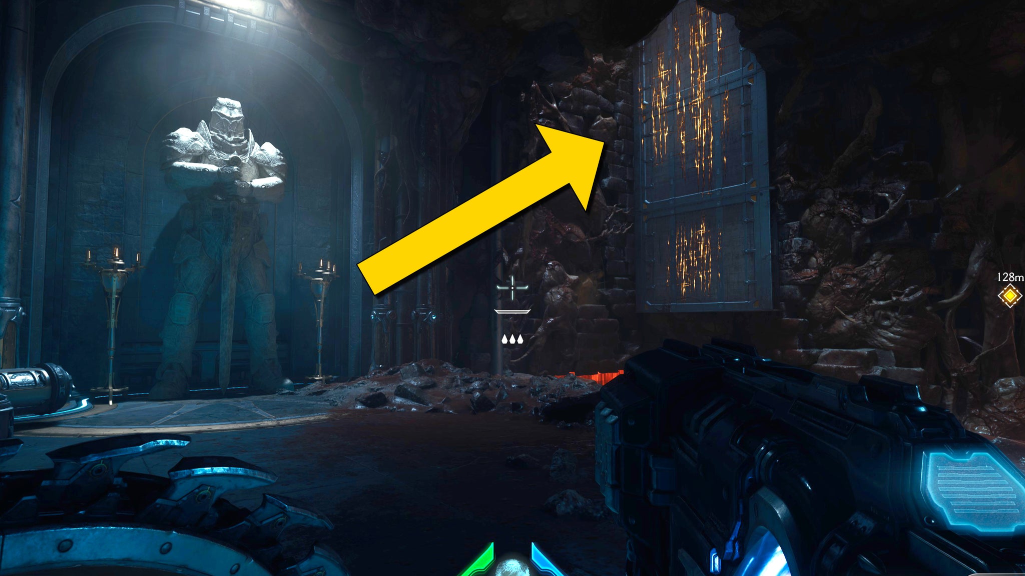 The player in Doom: The Dark Ages stands in front of a section of climbable wall by a large stone statue in Chapter 2. - 20