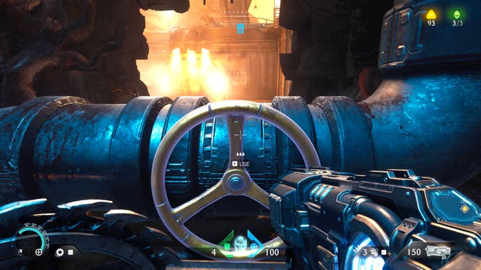 The player in Doom: The Dark Ages turns a circular wheel valve on a pipe in a room in Chapter 2, while looking through a hole in the wall towards a doorway covered in flames.