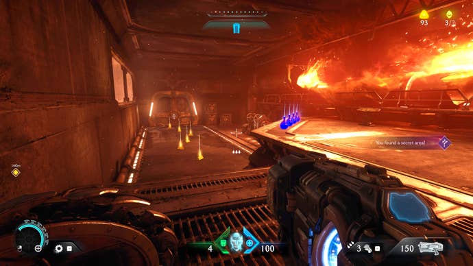 The player in Doom: The Dark Ages walks down the corridor of a secret area in Chapter 2 lit by flames and littered with Gold pickups.