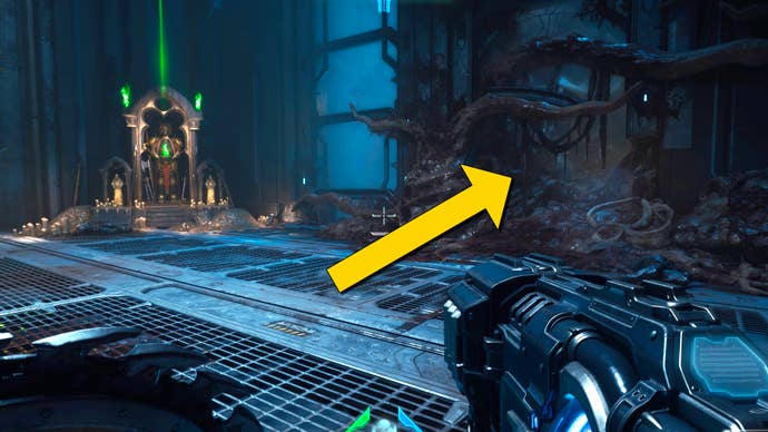 The player in Doom: The Dark Ages stands in front of a Sentinel Shrine towards the end of Chapter 2. A yellow arrow points towards a hole in the wall surrounded by fleshy tendrils nearby