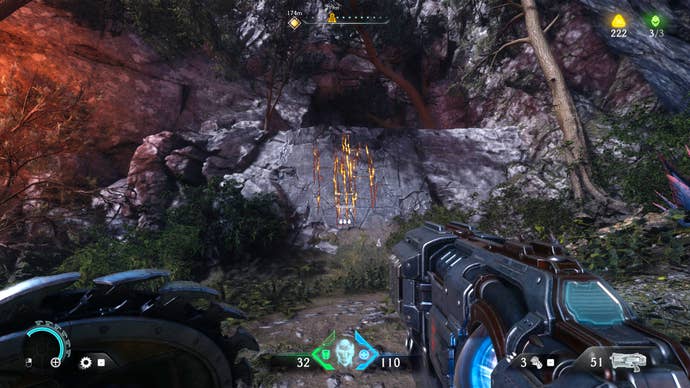 The player in Doom: The Dark Ages surveys a section of climbable rock wall into a cave in Chapter 4.