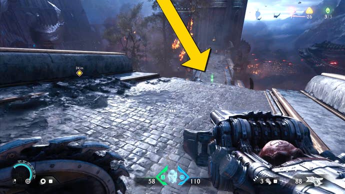 The player in Doom: The Dark Ages approaches a section of broken bridge in Chapter 4. A yellow arrow indicates for them to jump down to the next section of bridge.
