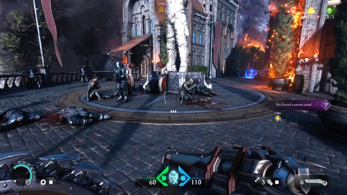 The player in Doom: The Dark Ages discovers a secret area on an upper balcony level of a building in Chapter 4, where several NPCs are hiding and a skin collectible pickup can be seen in the background.