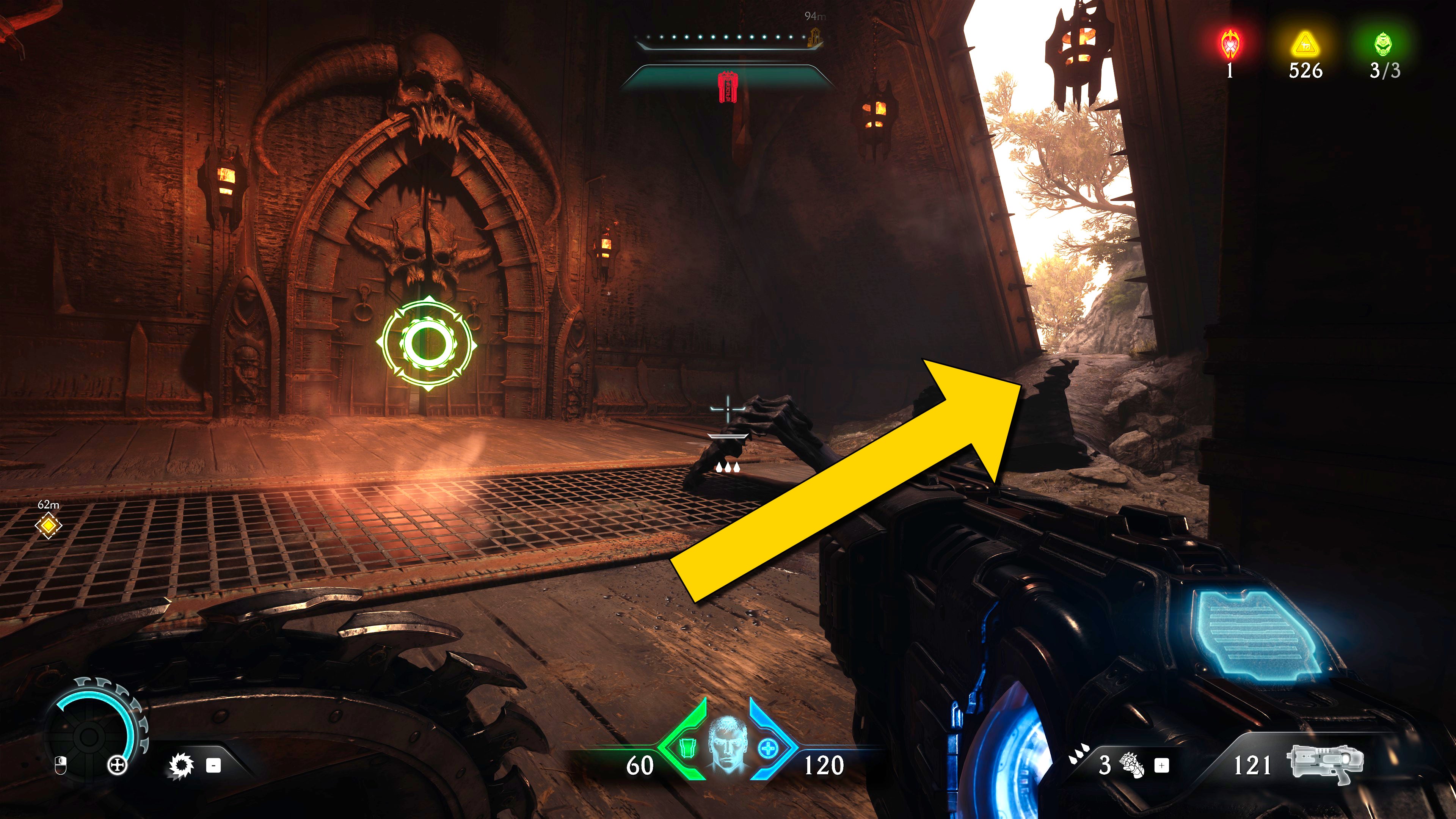 The player in Doom: The Dark Ages stands in front of a breakable door marked by a green circular icon. A yellow arrow points to a pathway outside to the right. - 24