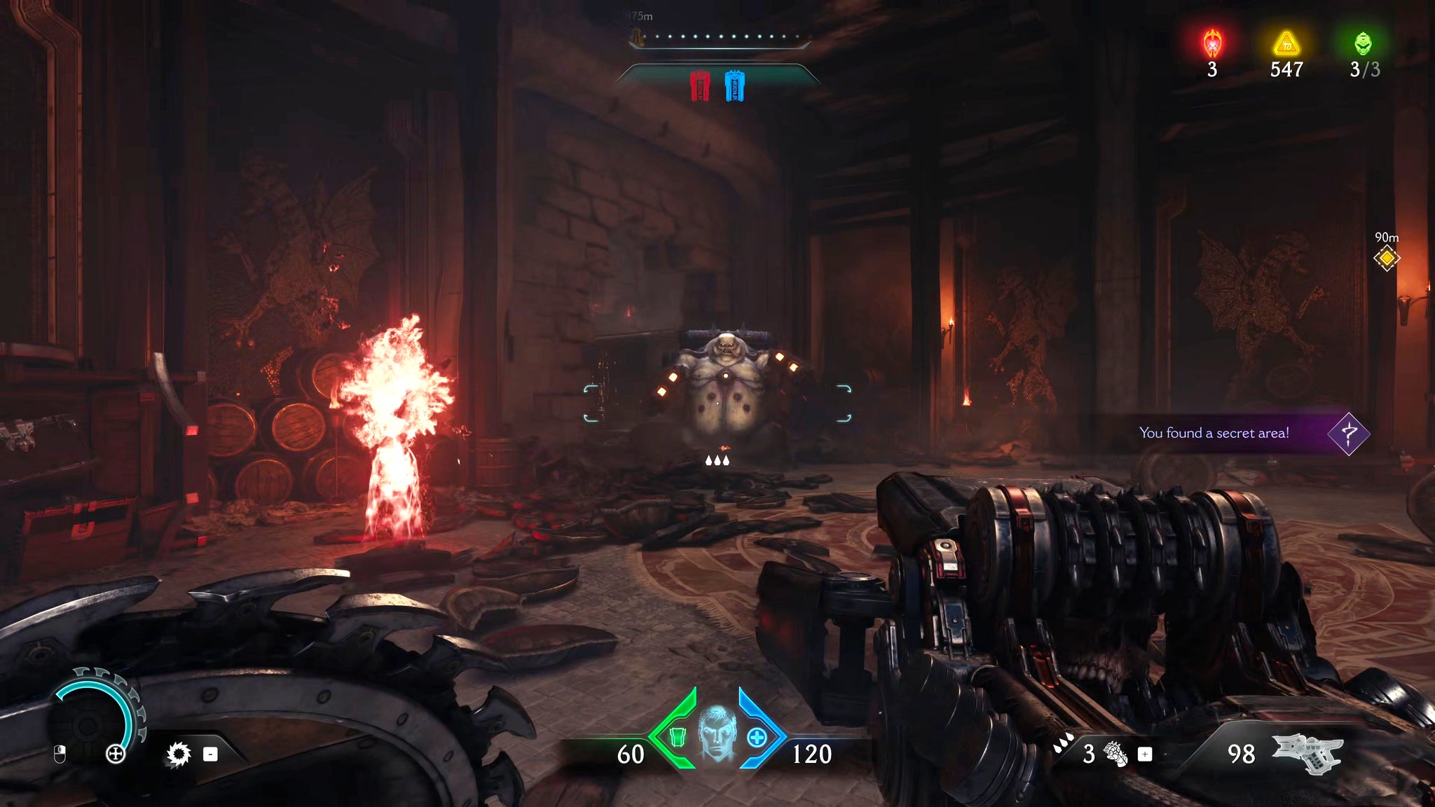 The player in Doom: The Dark Ages fights a Mancubus demon in a dimly lit secret room while other demons spawn around them. - 39