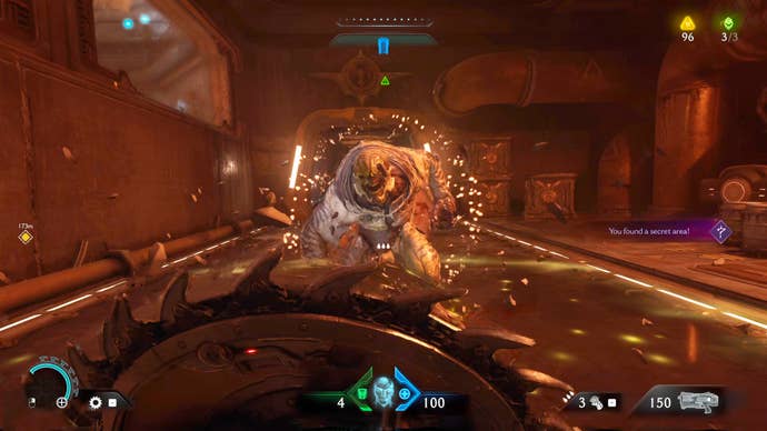 The player in Doom: The Dark Ages faces off against a Hell Knight in a flame-lit corridor in Chapter 2.