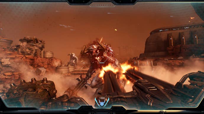 The player unloads a minigun into an enemy demon.