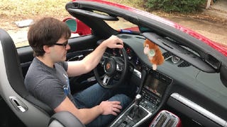 Man mods his Porsche 911 to play Doom using the steering wheel, shifter, and horn - or does he?