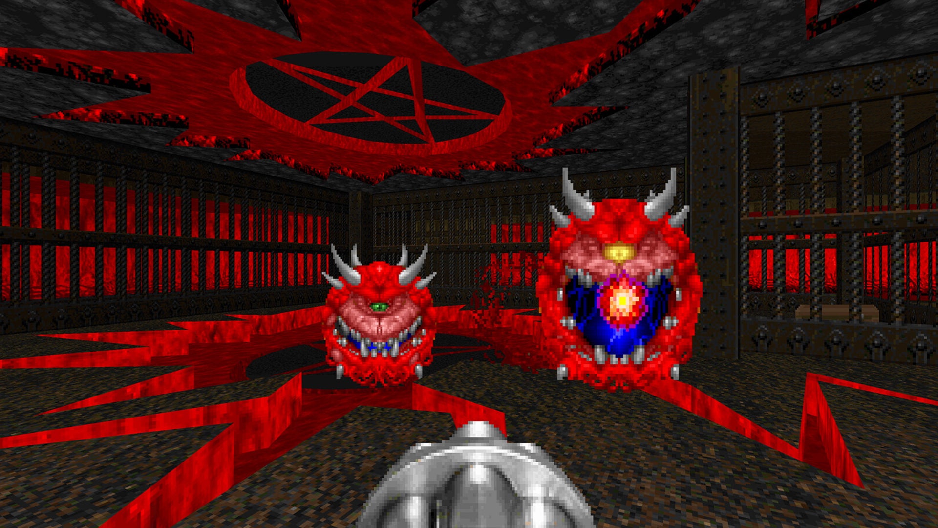 A gatling gun being pointed at some classic Doom blob demons in Doom. - 1
