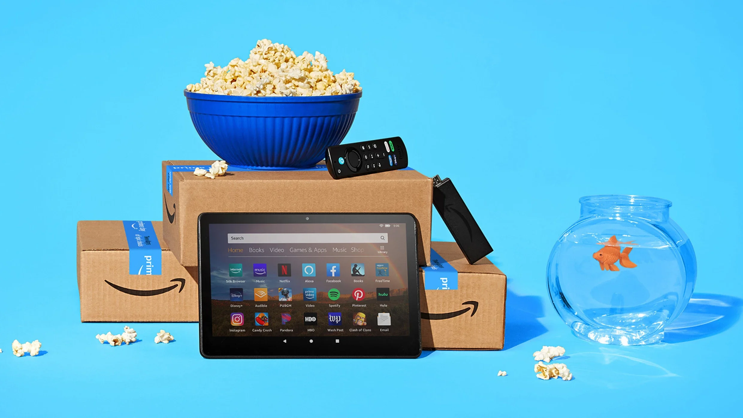 Amazon Prime Big Deal Days promo image with a fish bowl, tablet, and Amazon boxes
