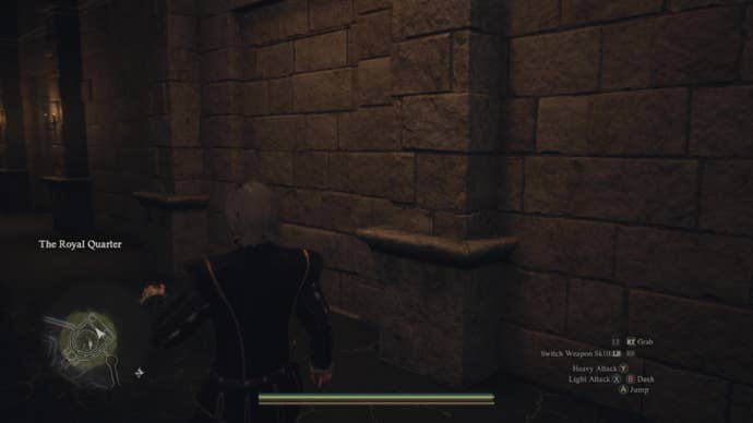 A castle wall with the outline of a “hidden” doorway visible in the stonework.