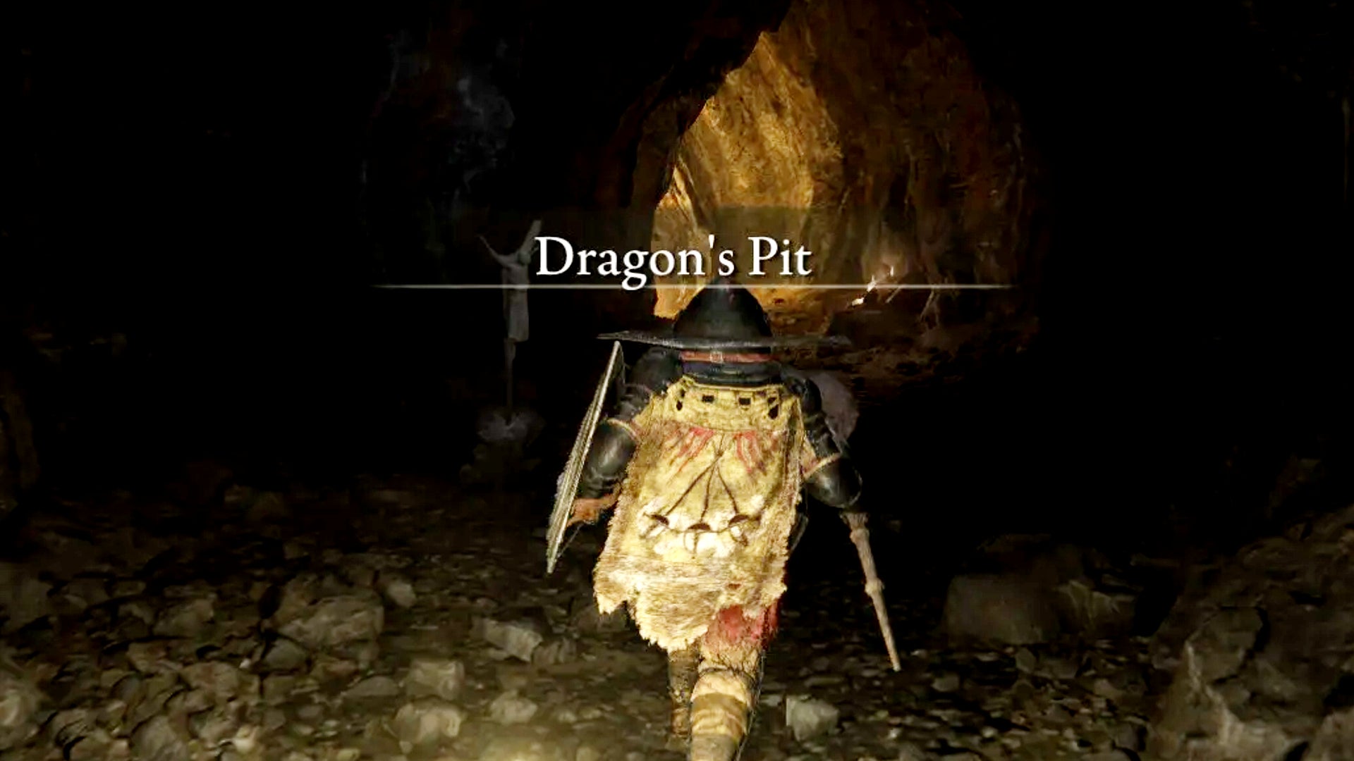 A Tarnished enters the Dragon&rsquo;s Pit in Elden Ring: Shadow of the Erdtree.