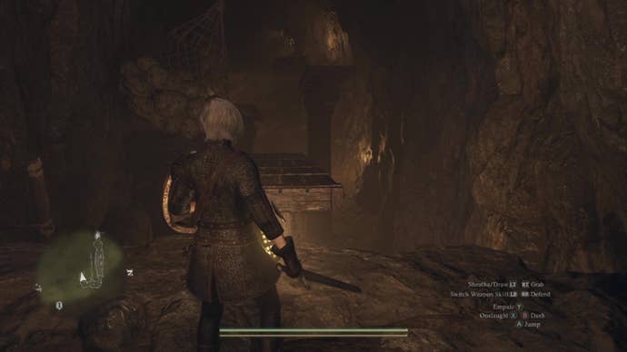 A human female Arisen looks across an underground chasm above which hangs an obstacle course made of seesaws and swinging weights.