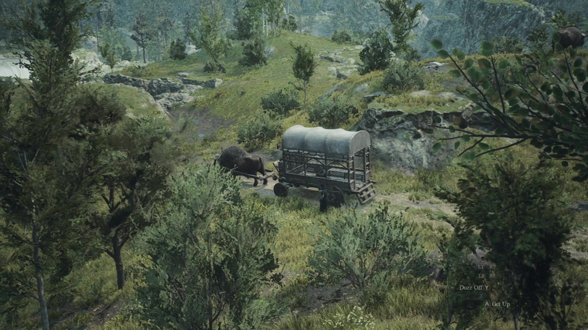 An oxcart travels through peaceful countryside landscape. - 1