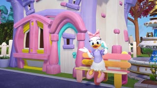 A Disney Dreamlight Valley screenshot showing Daisy Duck sat on a bench and chatting on her mobile phone.