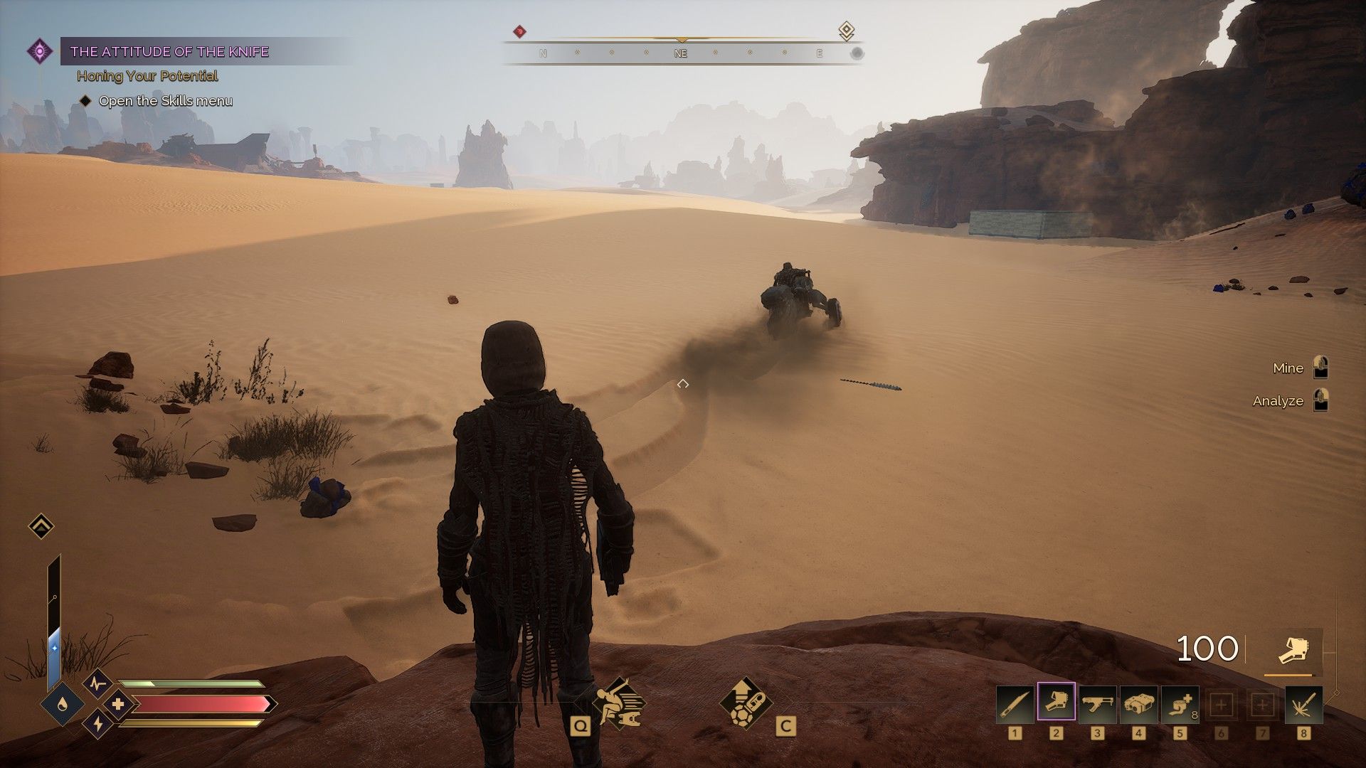 The player watches as another player scoots off on a sandbike. - 6