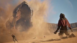A desert, and a character is on their knees looking into the oncoming maw of a gigantic sandworm. If they don't move - and it doesn't look like they're going to - they're in trouble. A screenshot from Dune: Awakening.