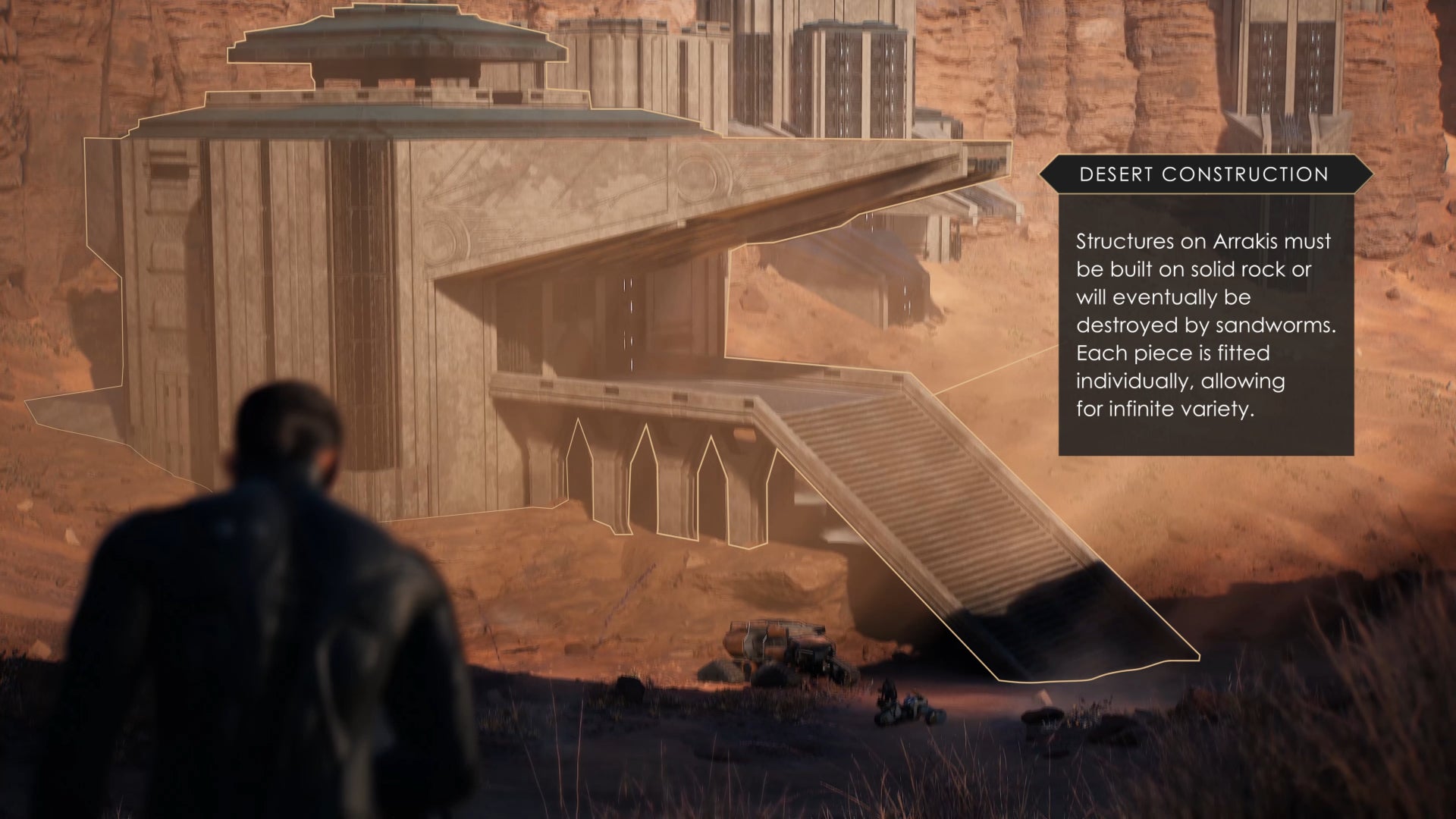 A player in Dune: Awakening looks down towards a nearby base and the vehicles parked outside.