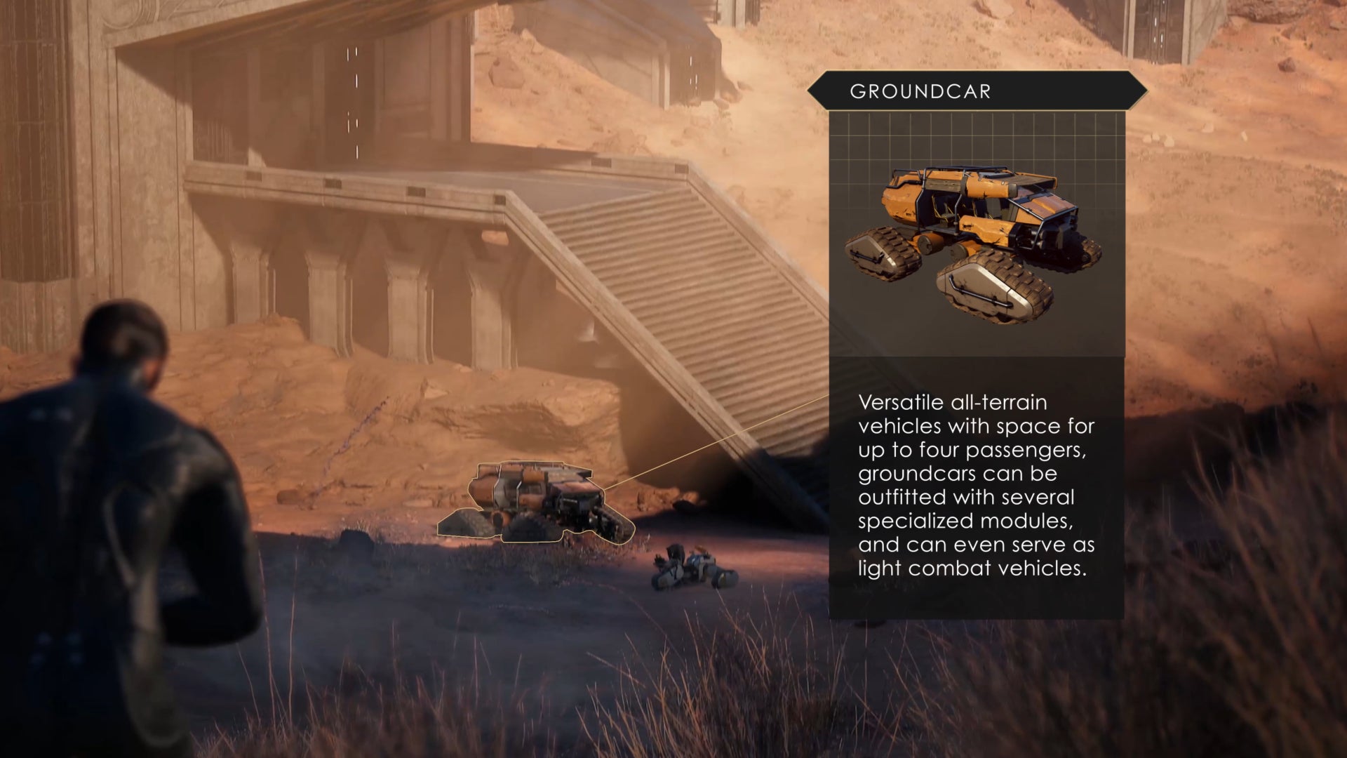 A player in Dune: Awakening looks down towards a nearby base and the vehicles parked outside.