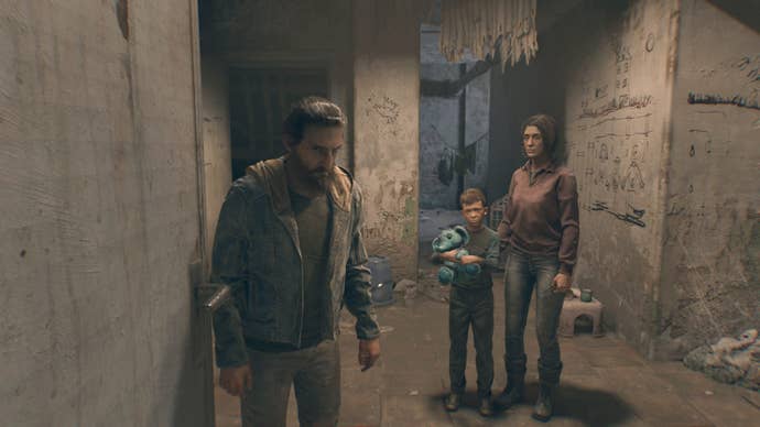 Dying Light: The Beast screenshot showing a downcast father, mother and son inside a bleak stone room.