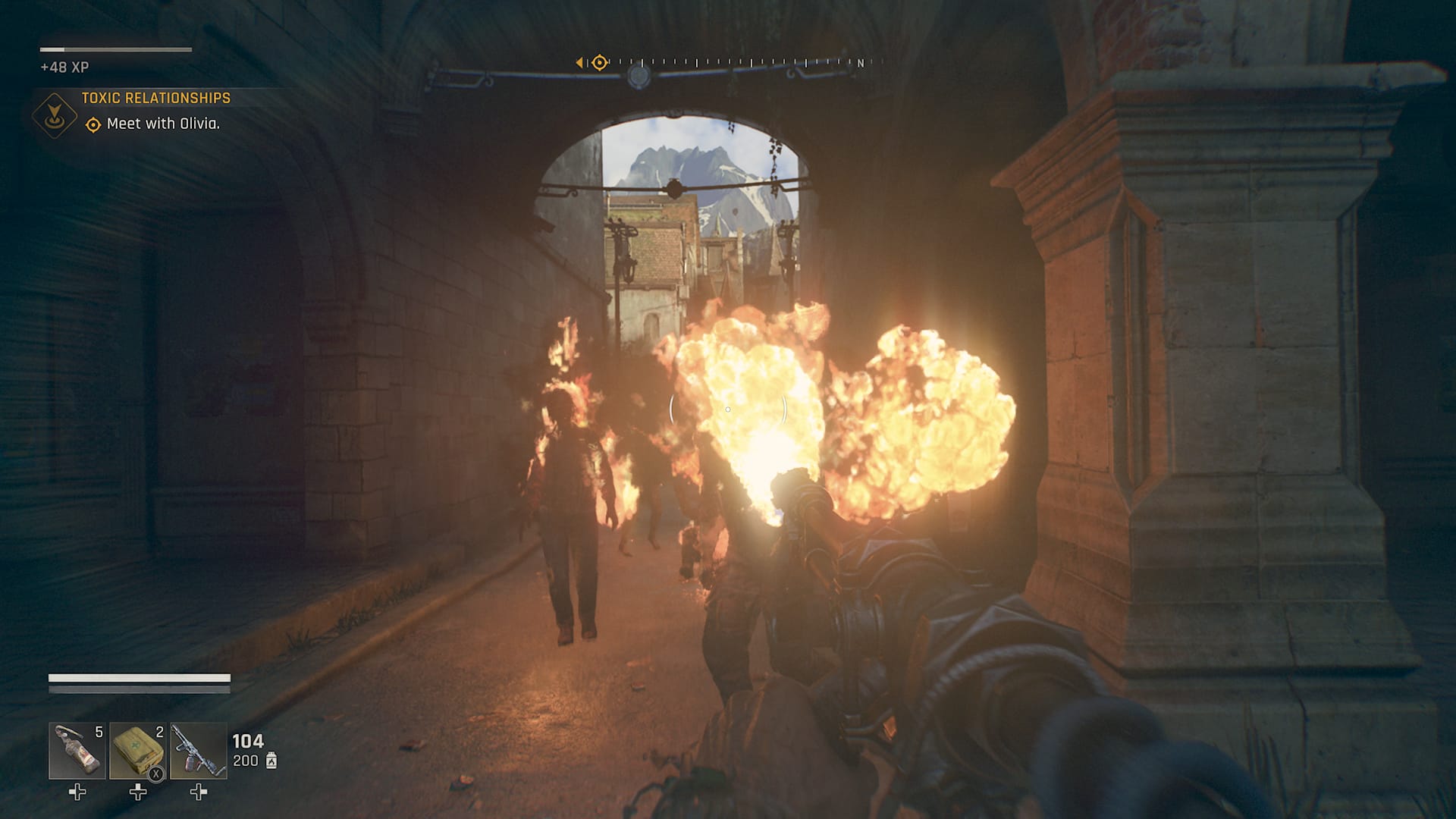 Dying Light: The Beast screenshot showing Kyle Crane incinerating Biters with a flamethrower alongside a stone column.