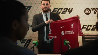 A footballsman holds his new shirt aloft at a press conference in EA Sports FC 24.