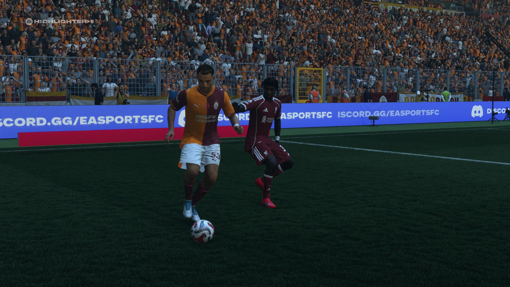 Baris Yilmaz shielding the ball from Jeremie Frimpong in EA Sports FC 26. - 4