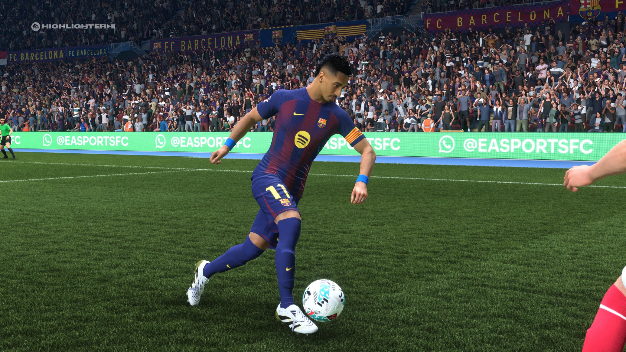 Raphinha using a stepover to beat an opponent in EA Sports FC 26. - 1