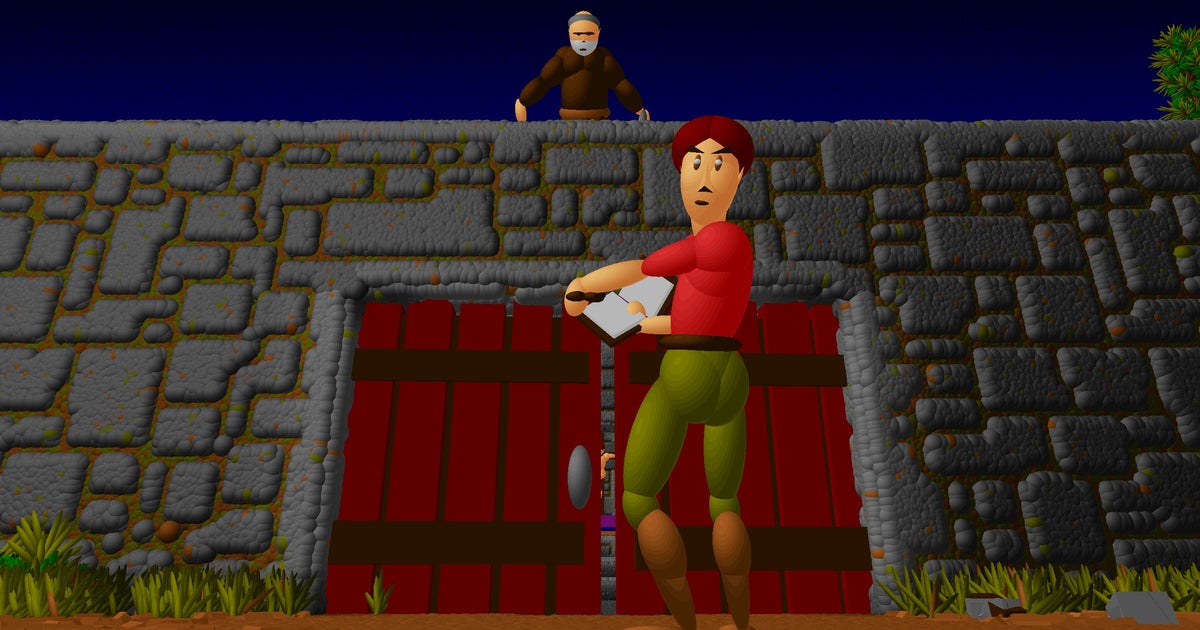 Ecstatica remaster screenshot showing its hero turning to look at the camera as he reads from a book in front of a large red gate in an imposing stone wall. A monk looks down on the scene in the background.