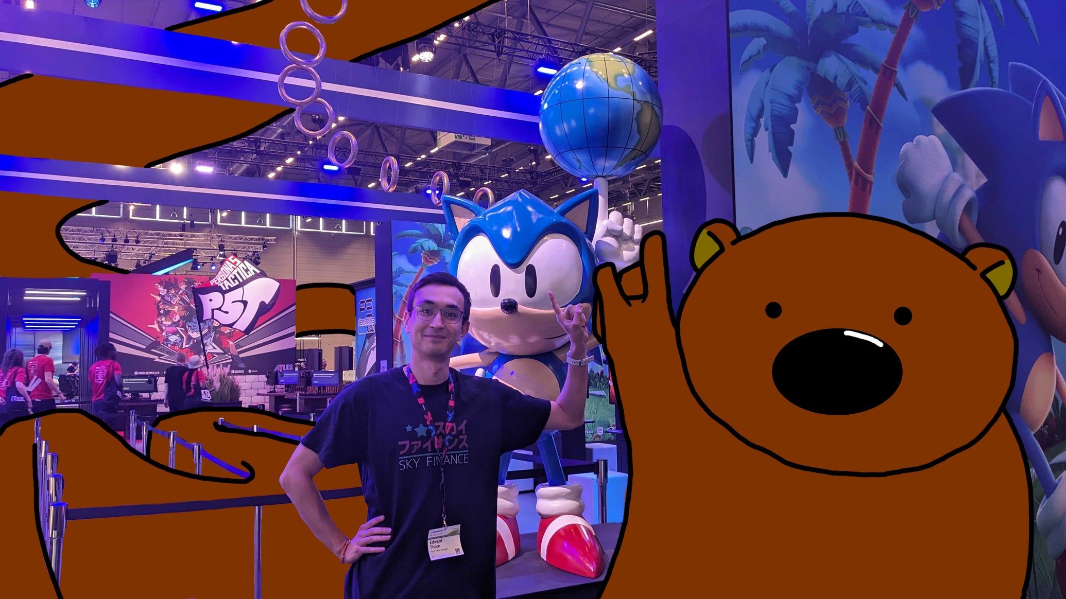 Ed Thorn poses next to a Sonic statue at Gamescom, with Horace the endless bear by his side - 1