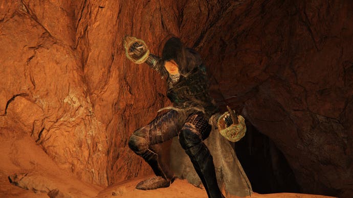 A warrior wields the Venomous Fang claws in Elden Ring.