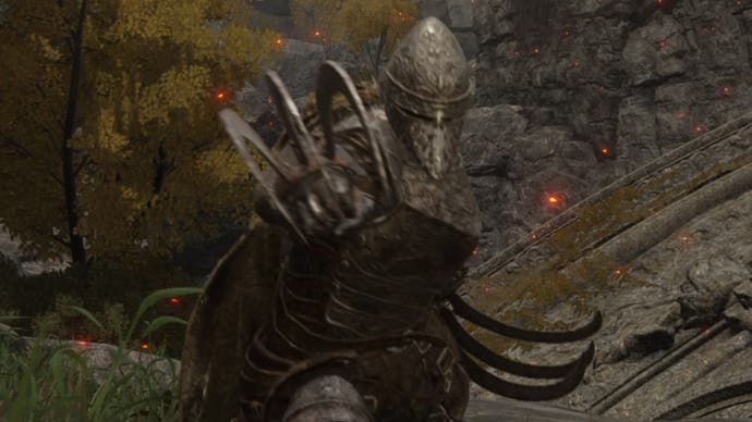 The player character lunges at the camera with the Bloodhound Claws in Elden Ring