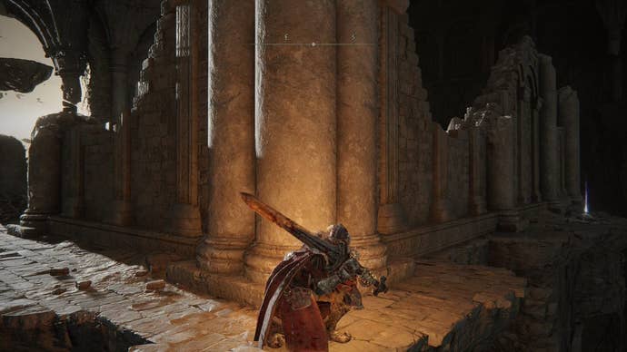 A warrior crouches next to some pillars in Crumbling Farum Azula in Elden Ring.