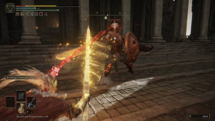 A warrior fights a Crucible Knight in Crumbling Farum Azula in Elden Ring.