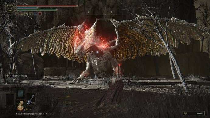 A warrior fights a large white dragon in Crumbling Farum Azula in Elden Ring.