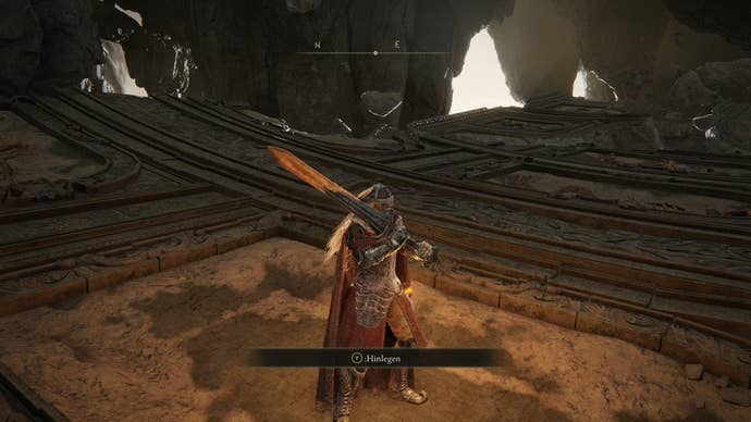 A warrior stands at the spot where you can lie down to trigger the hidden boss fight with the Dragonlord Placidusax in Crumbling Farum Azula in Elden Ring.