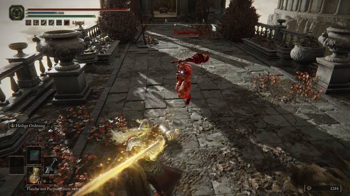 A warrior fights the Recusant Bernahl in Crumbling Farum Azula in Elden Ring.