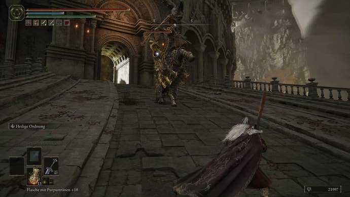 A warrior approaches a Draconic Tree Sentinel in Crumbling Farum Azula in Elden Ring.