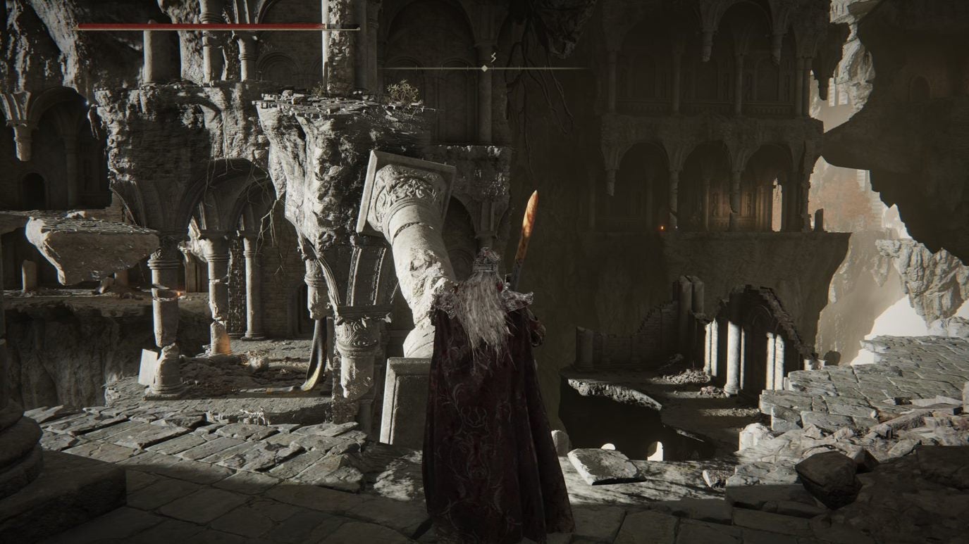 A warrior approaches fallen pillar to climb up it in Crumbling Farum Azula in Elden Ring.