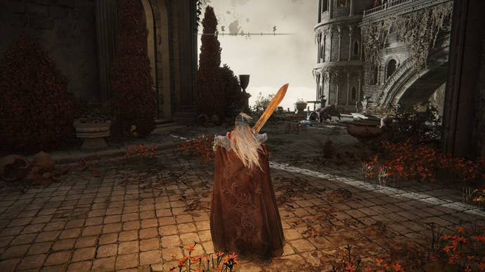A warrior stands with a sword in the courtyard of the Crumbling Farum Azula region in Elden Ring.