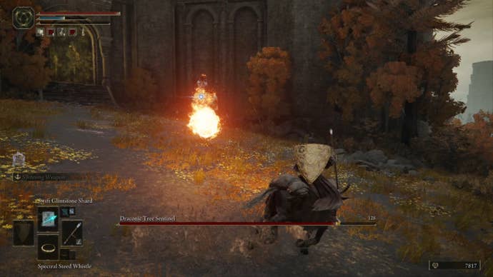 Elden Ring player wearing brown sorcerer robes dodges a fireball from the Draconic Tree Sentinel in a field