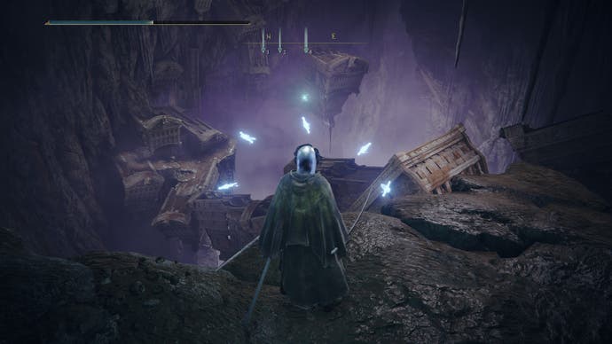 Screenshot from Shadow of the Erdtree showing a Tarnished standing on the precipice of a chasm filled with old ship ruins