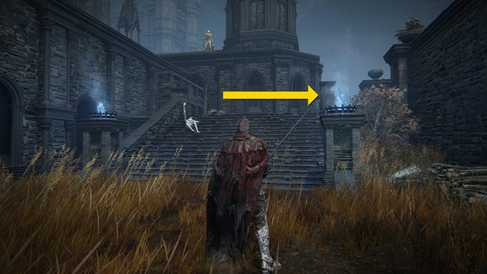 The player in Elden Ring: Shadow Of The Erdtree follows the main path up some stairs in Castle Ensis. A yellow arrow marks the path towards an Imbued Sword Key.