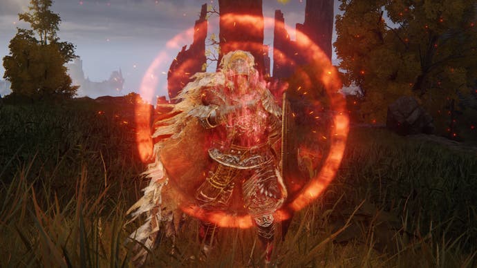 The player character is surrounded by a glowing red aura while casting the Flame, Grant Me Strength incantation in Elden Ring
