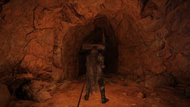 A player in Elden Ring lights their surroundings in a cave with a Lantern.