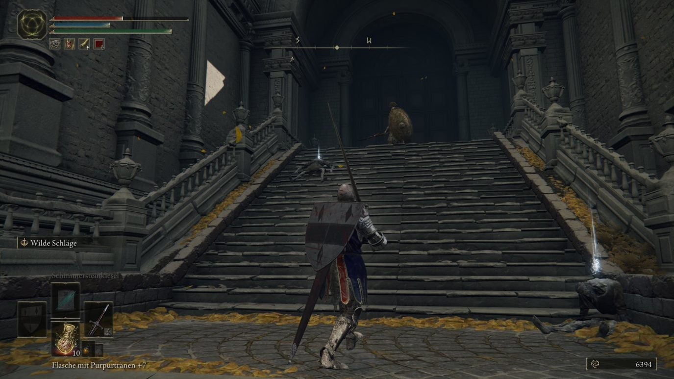 A warrior approaches a staircase in Leyndell, Royal Capital in Elden Ring.