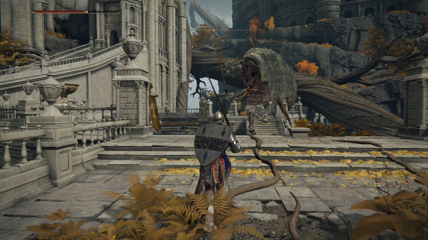 A warrior approaches a large tree root in Leyndell, Royal Capital in Elden Ring.
