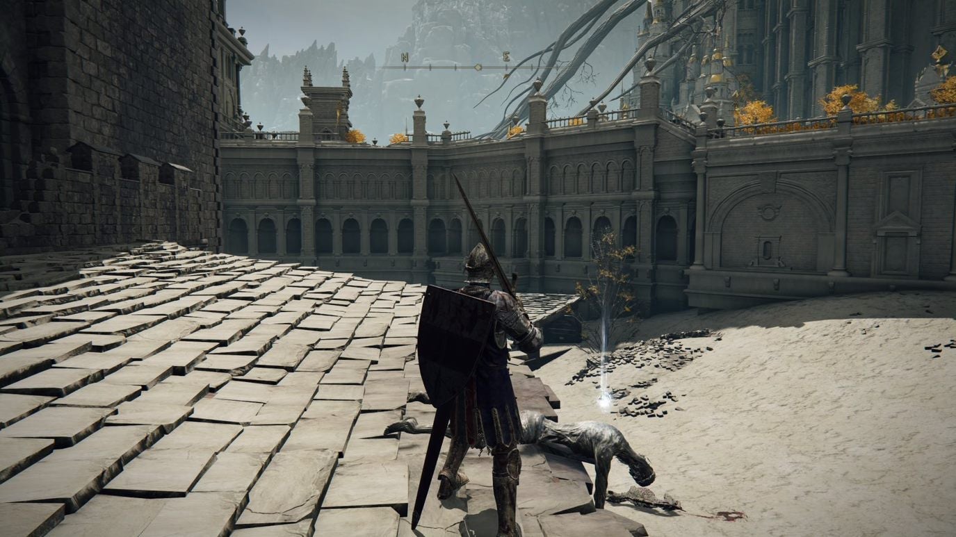 A warrior stands in front of a corpse on a rooftop in Leyndell Royal Capital in Elden Ring.
