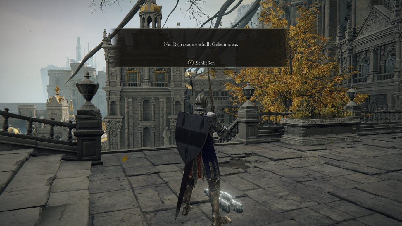 A warrior reads a message on the ground in Leyndell Royal Capital in Elden Ring.